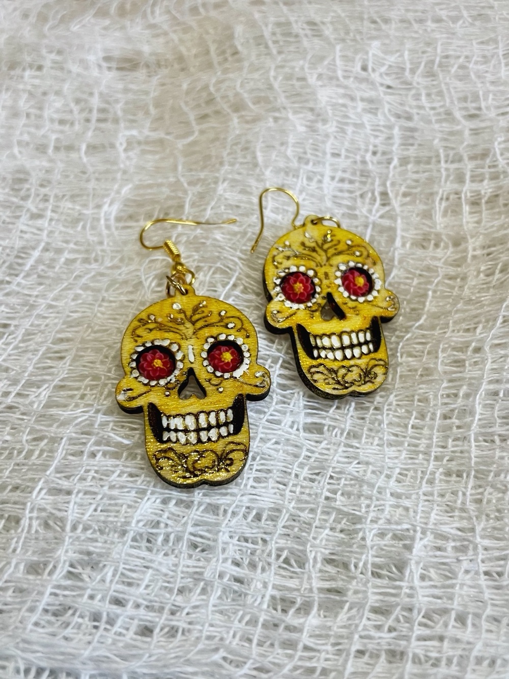 Gold Skull Drop Earrings with Red Gem Eyes